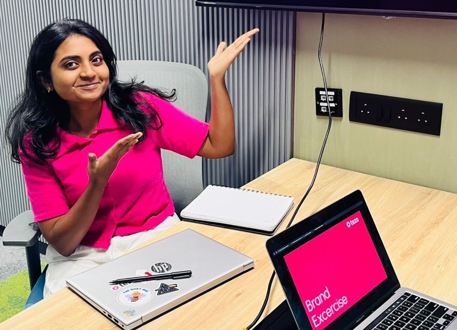 A cheerful Harika in a pose, suggesting fun gift ideas with a bright smile.